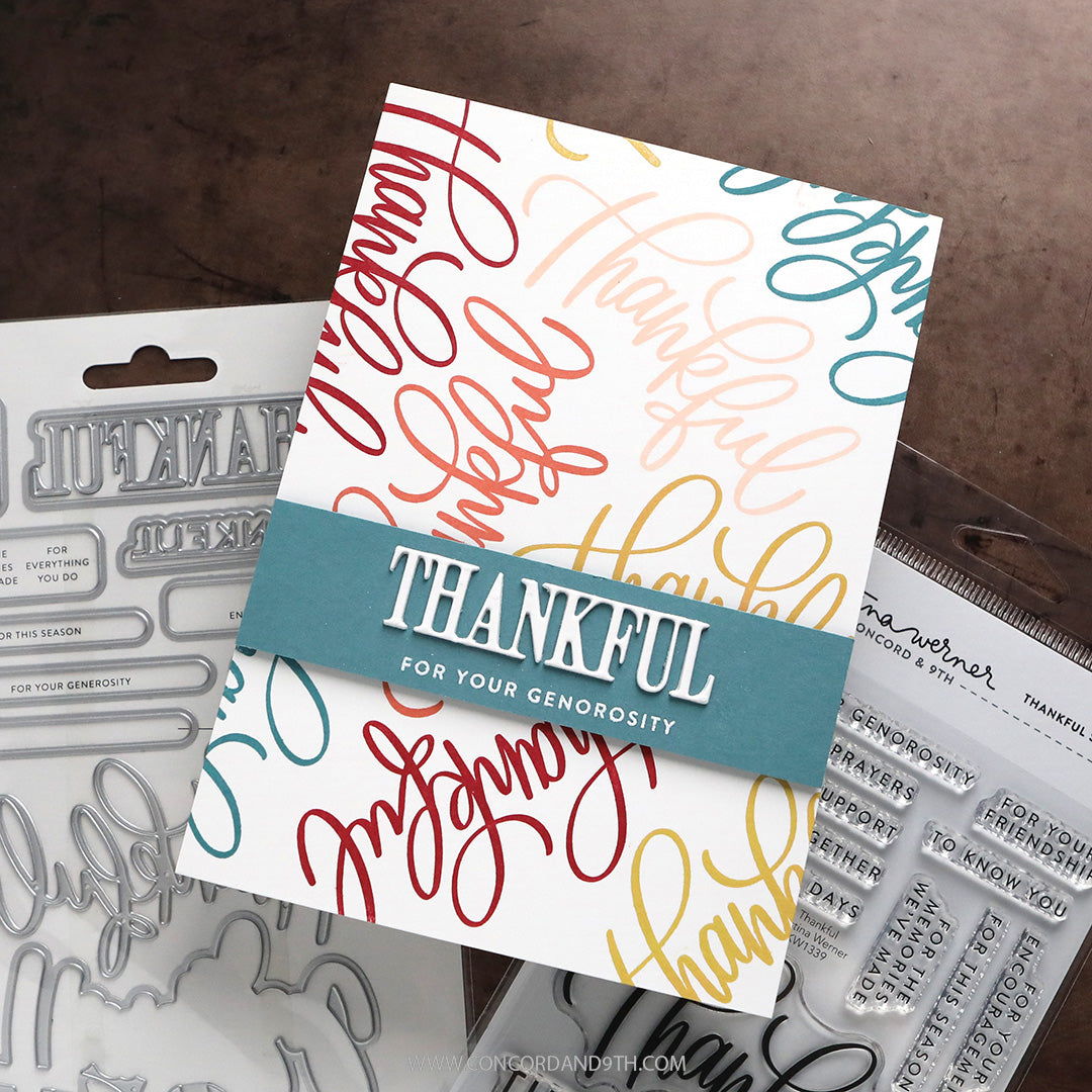 A handmade thanksgiving-themed card featuring colorful script text and a teal banner reading 'THANKFUL FOR YOUR GENEROSITY', shown with metal and clear stamp dies and a stamp block in the background.