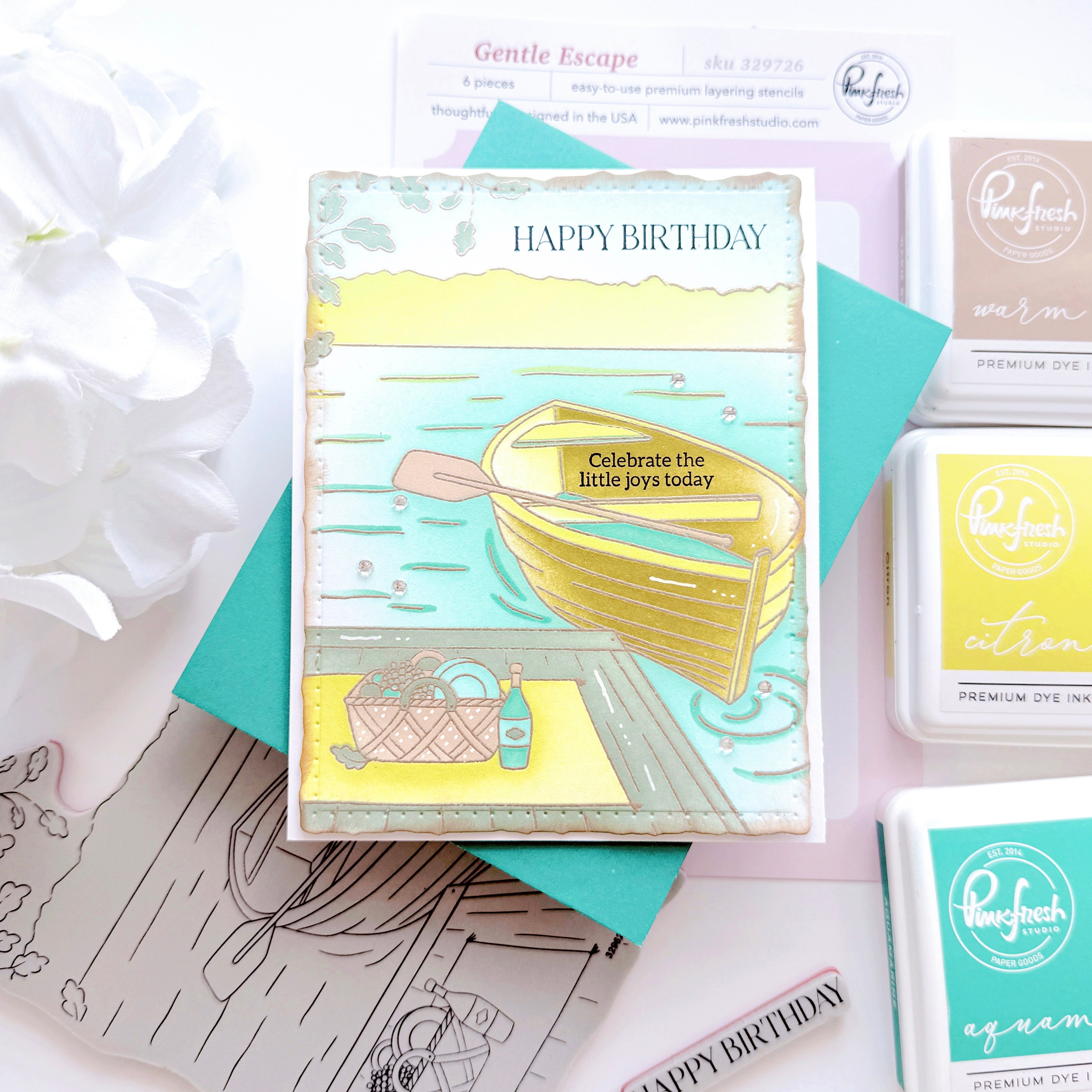 Birthday card with illustrations and 'Happy Birthday' text, surrounded by rubber stamps on a light background.