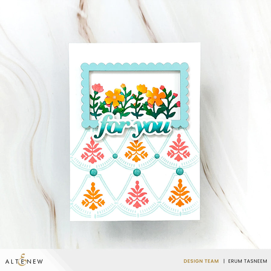 A handmade greeting card with a white base, featuring a scalloped light blue frame at the top containing colorful flowers and the words 'for you' in layered script. Below, a fan-shaped cutout design displays pink and orange floral motifs with small teal beads.