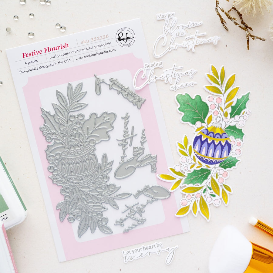 Festive Flourish 4-press plates by Pinkfresh Studio, shown flat on a white background with sample stamped and die-cut holiday decorations.