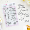 A flat-lay of Pinkfresh Studio's Simply Said 8-piece clear photopolymer stamp set on a white background, alongside matching black script letter stickers spelling birthday and greeting phrases.