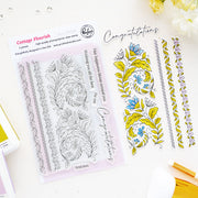A flat-lay product photo of a clear stamp set and matching decorative stamp designs from Pinkfresh Studio called Cottage Flourish. The set includes a package of six clear stamps with floral and scroll designs, and six matching colored stamp designs in yellow, blue, and white, arranged on a white background with a gold pen and flowers as props.