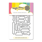 Waffle Flower Craft Die 'Nutcracker Sentiments Matching Die' in its retail packaging, featuring metal cutting dies on a white backing card with a colorful header.
