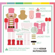 A flat lay sheet of Waffle Flower paper craft stamps and dies for making a nutcracker, showing all cut pieces labeled with names like hair, face, hat, jacket, boots, and hands on a white background with a colorful border.