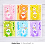 Six handmade colorful teddy bear greeting cards arranged in a 2x3 grid on a white wood background. The cards feature different bear designs in pink, orange, yellow, green, blue, and purple, with text reading HUGS, LOVE, XOXO, and names Marine Simon and Pretty Pink Posh.