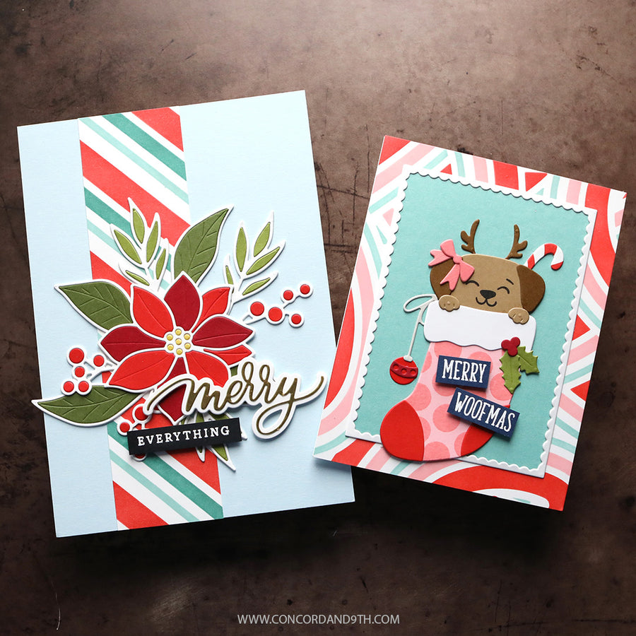 Two handmade Christmas greeting cards displayed on a dark brown textured surface. The left card has a light blue background with a red poinsettia, green leaves, red and green diagonal stripes, and a 'Merry Everything' script.