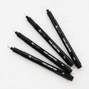 Set of Altenew black fine liner pens on a white background