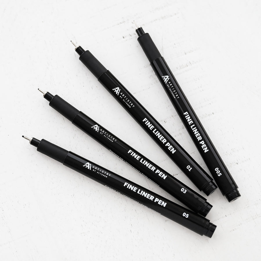 Set of Altenew black fine liner pens on a white background
