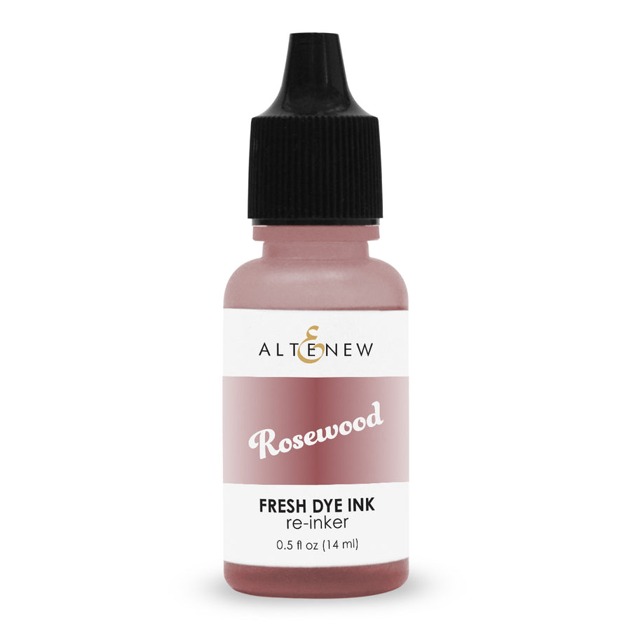 An Altenew Rosewood Fresh Dye Ink re-inker bottle, 0.5 fl oz (14 ml), featuring a dusty rose pink bottle, a white label with black and gold text, and a black dropper cap, set against a plain white background.
