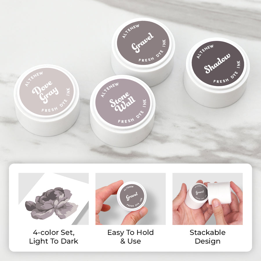 Four small round white mini pods of Altenew Fresh Dye Ink shadow powder in different gray tones are arranged on a light marble surface, with three more jars behind them. A white panel at the bottom shows feature callouts: 4-color set from light to dark, easy to hold and use, and stackable design. Altenew Tranquil Reflections Fresh Dye Ink Mini Pods