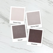Four square color swatches labeled Dove Gray, Stone Wall, Gravel, and Shadow arranged on a light marble surface. Altenew Tranquil Reflections Fresh Dye Ink Mini Pods