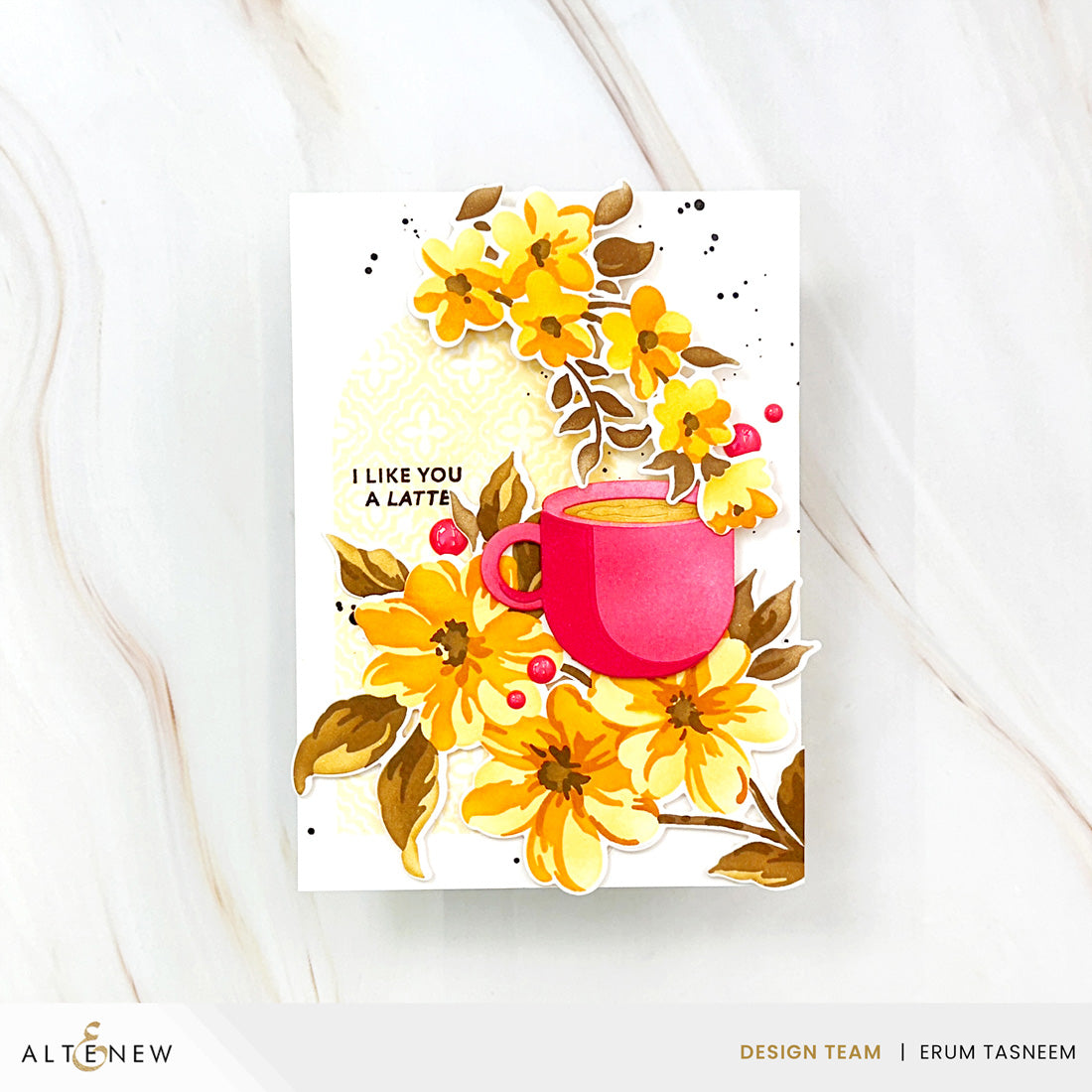 A handmade greeting card featuring a layered yellow floral design and a pink coffee cup with the text 'I LIKE YOU A LATTE.' The card is displayed on a white marble surface, with the Altenew logo in the bottom-left corner.