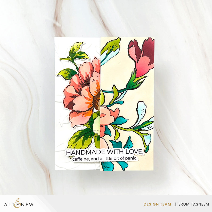 A handmade greeting card featuring a split floral design with pink and coral flowers, green leaves, and a cream background, with the text 'HANDMADE WITH LOVE, caffeine, and a little bit of panic.' The card is displayed on a white marble surface, with 'ALTENEW' and 'DESIGN TEAM | ERUM TASNEEM' visible at the bottom.