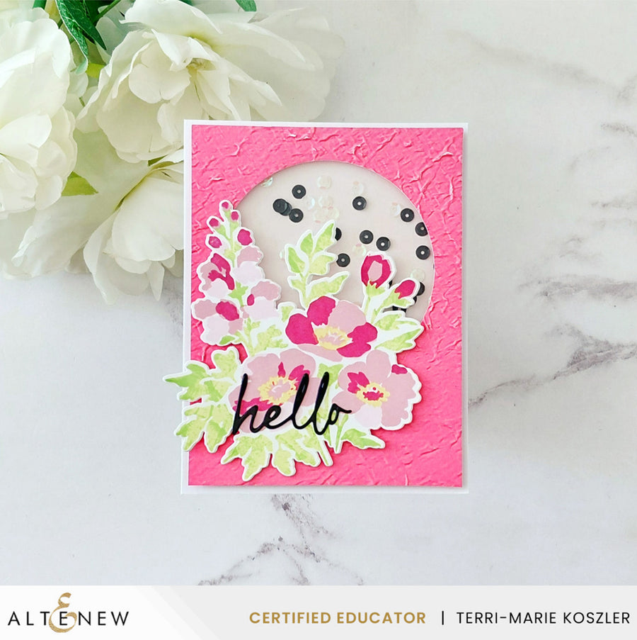 A handmade greeting card with a textured hot pink background, featuring a die-cut white oval with black dots, layered pink and green flowers, and the word 'hello' in black script. The card is displayed on a white marble surface next to white flowers, with an ALTENEW Certified Educator banner at the bottom. Altenew Craft Your Life Project Kit: Painterly Perfection card ideas