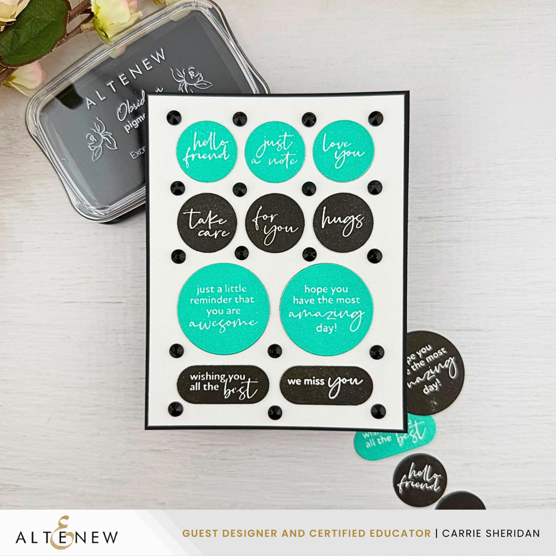 A handmade greeting card with black polka dots and teal and black circles containing handwritten-style phrases, displayed on a light wood surface with an Altenew ink pad and a few loose stickers nearby. Altenew One-Go: Solid Circular Sentiments Press Plate card ideas