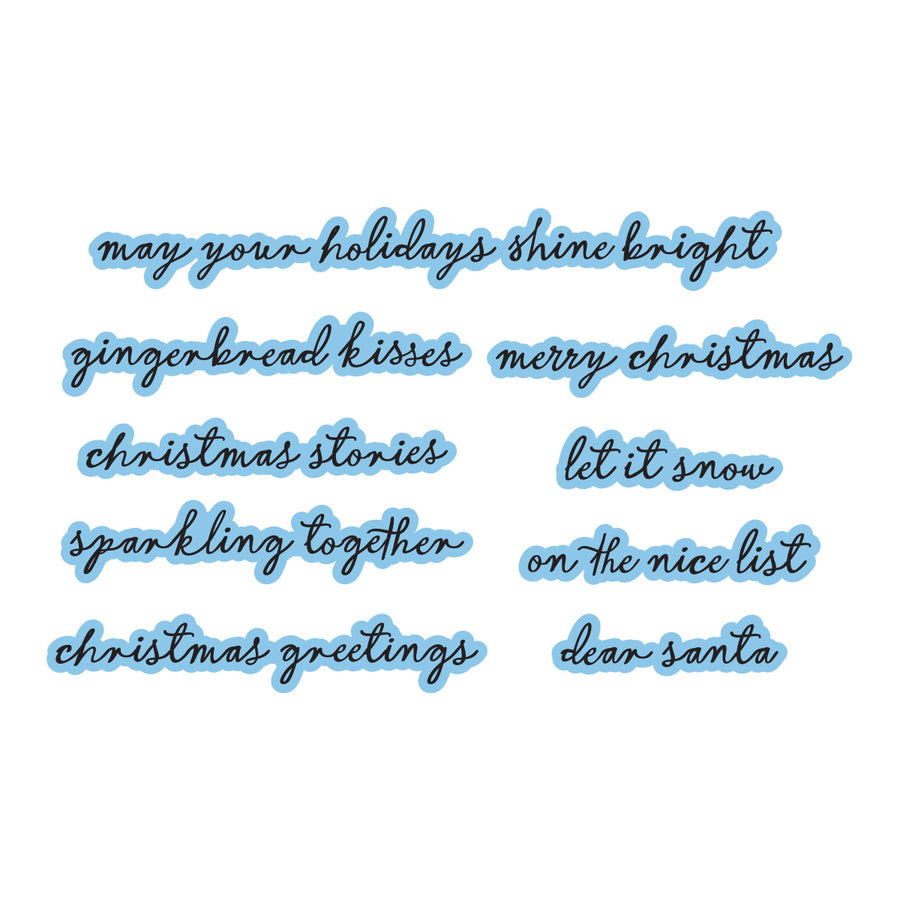 A sheet of holiday-themed die-cuts featuring cursive text phrases like 'may your holidays shine bright', 'gingerbread kisses', 'merry christmas', and others, outlined in light blue on a white background. Spellbinders Christmas Blush Sentiments Press + Foil Plate & Die Set by Frank Garcia