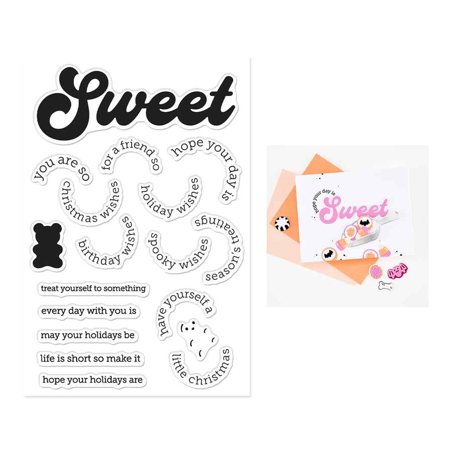 A sheet of sweet-themed clear stamps displayed next to a greeting card example. The stickers feature various holiday and seasonal phrases in black and white fonts, a black gummy bear, and a small white polar bear face.
