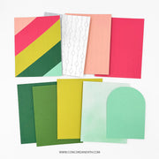 A set of colorful patterned and solid paper sheets arranged on a white background, including geometric designs, fine line patterns, watercolor washes, and an arched mint green piece. The brand name Concord and 9th is printed at the bottom.