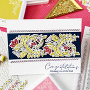 Handmade greeting card stamped in black in and die cut out. Die cut coloured in greens, reds and pinks and layered on a black rectangle panel and layered on top of a white rectangle card base with the sentiment 'Congratulations Wishing you all the best'