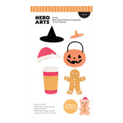 Hero Arts Bear Hugs Holiday Accessories 15 Cutting Dies sheet (DF331) featuring various Halloween-themed shapes including a witch hat, Santa hat, jack-o'-lantern bucket, gingerbread man, coffee cup, and teddy bear, shown on a white background with product details and a small coordinating die set badge.