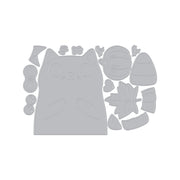 A gray die-cut craft template featuring a cute cartoon cat face surrounded by autumn-themed shapes including a pumpkin, acorn, leaf, and candy corn, shown on a plain white background.