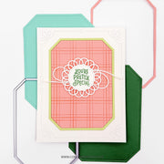A handmade greeting card with a coral pink plaid pattern, a white scalloped die-cut circle, and green text reading 'You're Pretty Special,' layered over teal, green, and pink octagonal cardstock pieces on a white background.