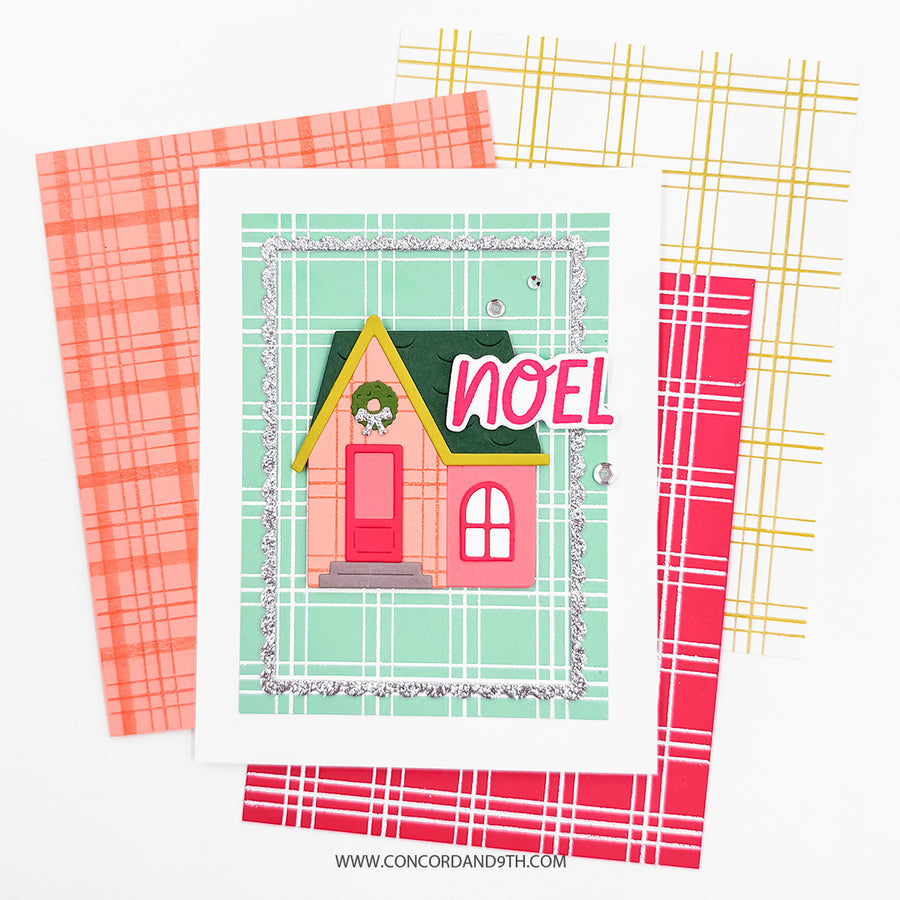A handmade Christmas greeting card featuring a cute pink house with a green roof and the word 'NOEL' in pink letters, layered over three plaid patterned cardstock sheets in coral, yellow, and red. The brand name 'Concord and 9th' is visible at the bottom.