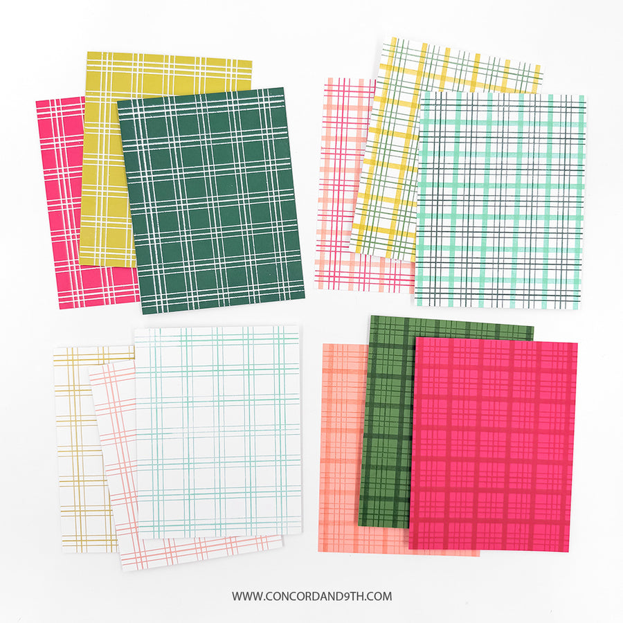 Six sheets of patterned paper arranged in two overlapping stacks on a white background. The papers feature plaid and grid patterns in various colors including green, pink, yellow, orange, and blue on white bases.