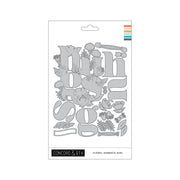 Concord & 9th Floral Embrace Dies set in a white hanging card package, featuring gray metal letter and flower cutout designs on a white background.