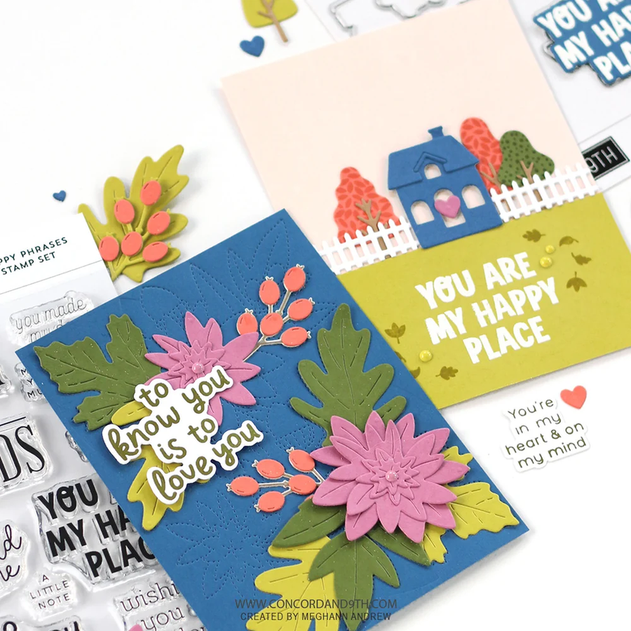 Two handmade layered cardstock greeting cards displayed on a white background, showcasing floral designs and text. One card is blue with pink flowers and the phrase 'to know you is to love you', and the other is yellow-green with a house and the phrase 'YOU ARE MY HAPPY PLACE'.