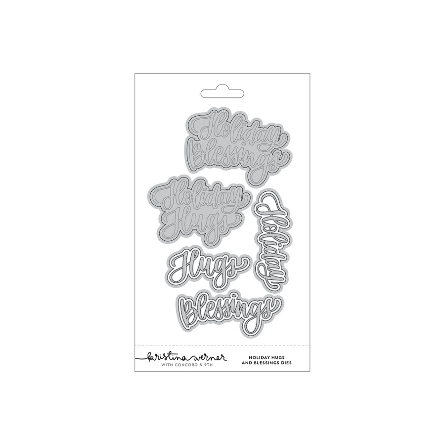 A packaged set of metal die-cut stickers featuring holiday greetings including 'Holiday Blessings,' 'Holiday Hugs,' 'Jugs Blessings,' and 'Jugs.' The product is shown on a plain white background with its retail backing card visible.