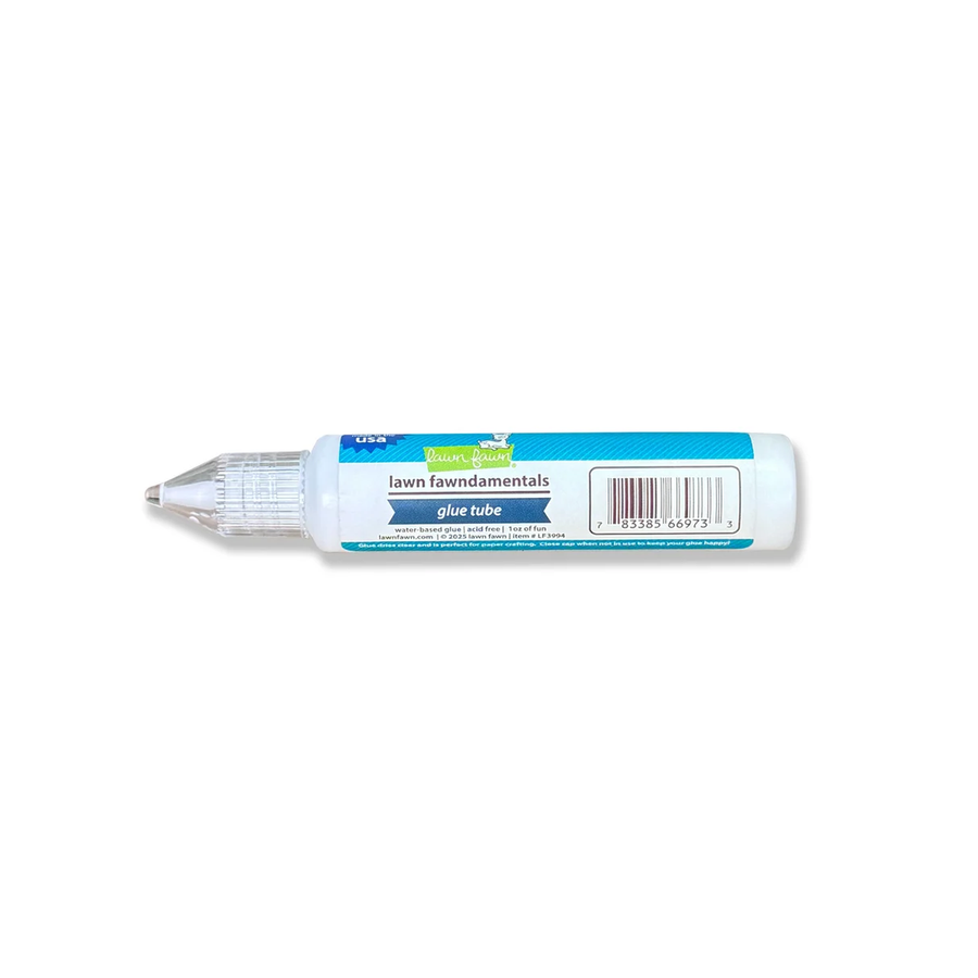 A tube of Lawn Fawnamentals glue tube, featuring a white body with a blue label and a clear pointed applicator cap, shown against a plain white background.