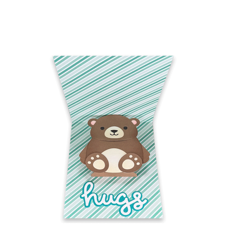 The inside of a handmade greeting card with a cute pop-up bear and the word 'hugs' on a mint green and white striped background, isolated on a white backdrop.