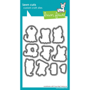 Lawn Fawn custom craft dies set in a white card package with a teal border. The package contains nine die shapes for creating irregular, organic cutouts, including a ghost, leaf, paw print. Lawn Fawn Cozy Dogs Dies