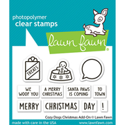 Lawn Fawn photopolymer clear stamps set featuring Christmas-themed stamps, including a gift bag with 'TREATS', a gingerbread cookie, a speech bubble, and holiday phrases like 'A MERRY CHRISTMAS' and 'MERRY CHRISTMAS DAY!'. Lawn Fawn Cozy Dogs Christmas Add-On Stamps