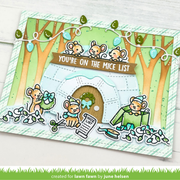 A handmade holiday card featuring cute cartoon mice around an igloo house, with the text 'YOU'RE ON THE MICE LIST' and small decorative details like ornaments and a wreath, photographed on a light wood background.