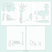 A set of six white die-cut paper stencils featuring minimalist park and street scene illustrations, including trees, benches, lampposts, and figures, arranged on a pale mint green background. Concord & 9th Park Bench Stencil Pack