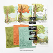 Six illustrated handmade greeting cards arranged on a white background, featuring trees, benches, bicycles, and black text boxes with phrases such as 'here's to you sleep,' 'your wonderful smile is so much fun,' 'missing you hello friend,' and 'it's a beautiful day for a beautiful day.'.