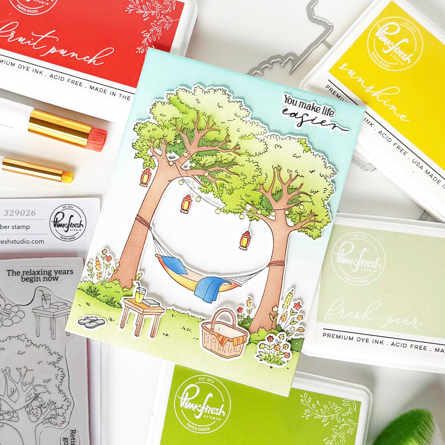 Packaging of ink pads and stamping supplies with a nature-themed design on a white background.