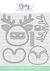A set of metal die-cut craft shapes for a reindeer face, antlers, and a bell, shown on a white background with a repeating 'Pretty Pink Posh' watermark. The brand name 'Pretty Pink Posh' is displayed at the top. Pretty Pink Posh Reindeer Face Shaker
