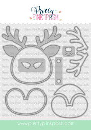 A set of metal die-cut craft shapes for a reindeer face, antlers, and a bell, shown on a white background with a repeating 'Pretty Pink Posh' watermark. The brand name 'Pretty Pink Posh' is displayed at the top. Pretty Pink Posh Reindeer Face Shaker