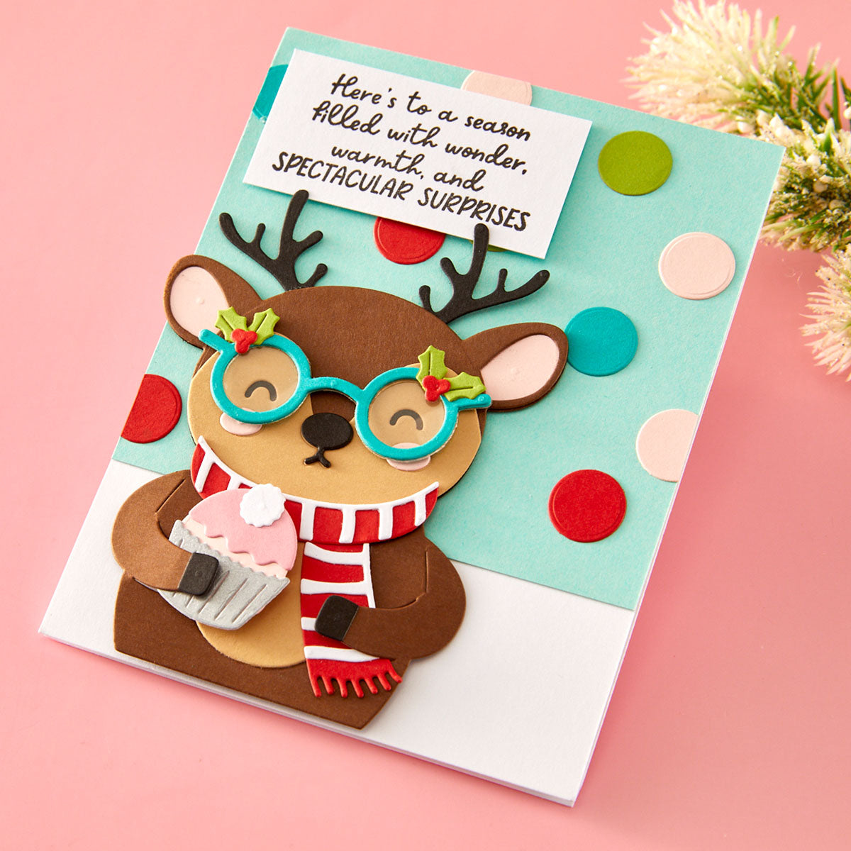 Christmas card with a reindeer wearing glasses and a scarf on a pink background Spellbinders Spectacular Christmas collection
