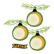 Three stylized cChristmas ornaments with green pine branches and a yellow banner reading “PEACE” on a white background. Spellbinders Stitched Baubles & Boughs Etched Dies