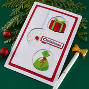 Christmas-themed card with decorative elements on a green background using Spellbinders Gift Boxes and Bags Etched Dies by Lisa Horton