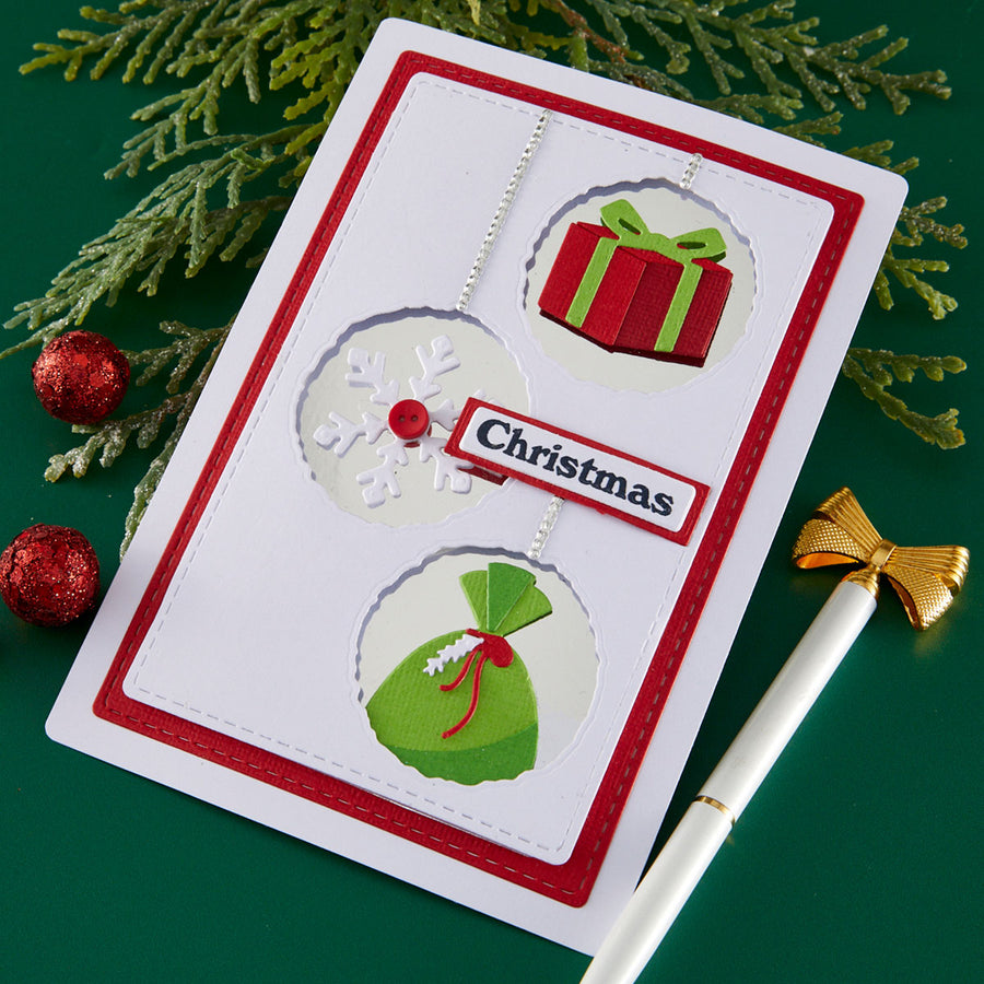 Christmas-themed card with decorative elements on a green background using Spellbinders Gift Boxes and Bags Etched Dies by Lisa Horton