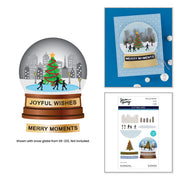 Christmas-themed snow globe card design shown with a blue card base, a printed snow globe illustration, and a cutting dies sheet. The snow globe features a green Christmas tree, black silhouettes of people, a snowy ground, and a gray city skyline. Spellbinders City Skating Scene Etched Dies by Simon Hurley