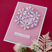 Greeting card with snowflake design and 'Holiday Sparkle' text on a red background