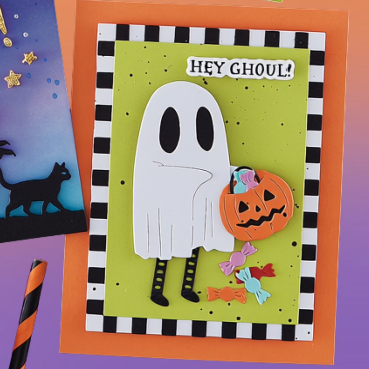 A handmade Halloween greeting card featuring a white ghost holding a jack-o'-lantern, with the text 'HEY GHOUL!' on a lime green background, bordered by a black-and-white check pattern. The card is displayed on an orange backing card with other themed card elements partially visible. Using Spellbinders Color Block Accent Rectangles Die Bundle