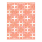A rectangular sheet of white cardstock or paper featuring a repeating pattern of small white floral or cross-like motifs on a soft peach-pink background, shown against a plain white backdrop. Spellbinders Quilted Etched Dies by Simon Hurley