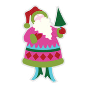 A colorful cartoon-style Santa Claus figure holding a small green tree, shown on a plain white background. The design uses bright pink, green, red, white, and light blue colors in a simple graphic style. Spellbinders Festive Santa Etched Dies by Lolli & Grace